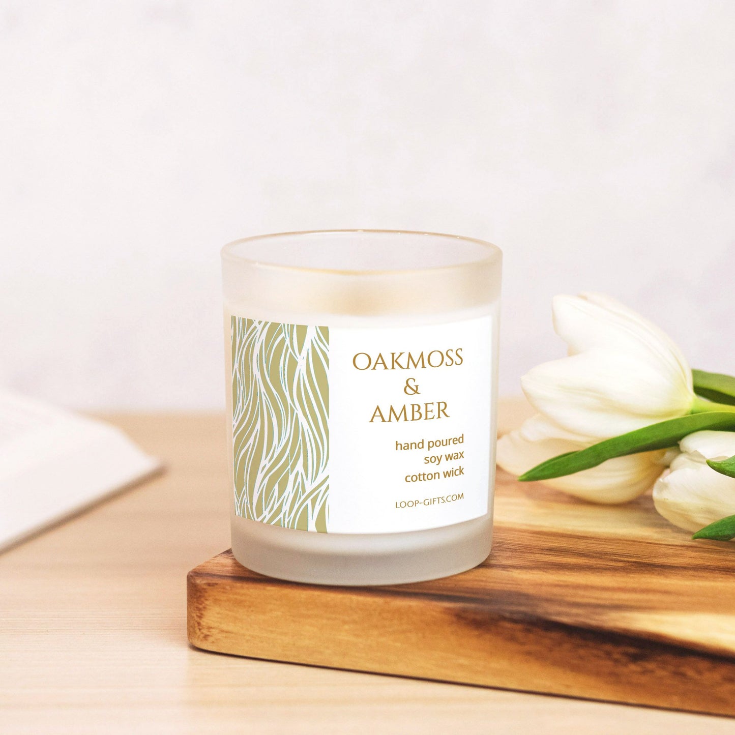 Eco-friendly soy candle with oakmoss and amber scent, wood wick, and 50+ hour burn time.